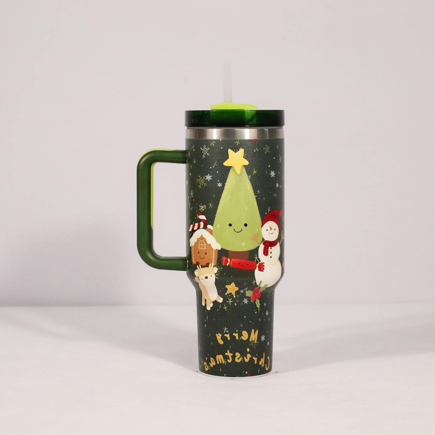 Christmas pattern mug with festive reindeer design and green handle, perfect for holiday beverages.