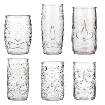 Transparent drinkware featuring unique embossed face designs in six cylindrical glass mugs.