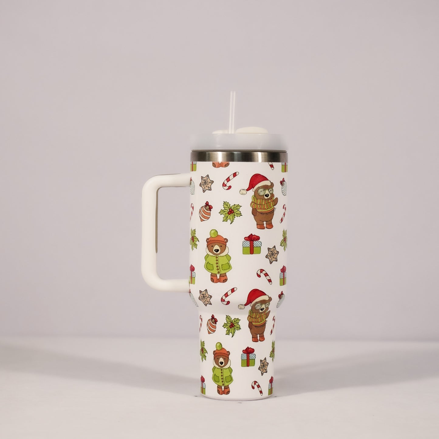 Christmas pattern mug with festive reindeer design and green handle, perfect for holiday beverages.