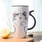 Cute cartoon ceramic cat mug with large capacity, perfect for coffee lovers and adding charm to drinkware.