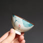 Chinese tea bowl with floral design, showcasing elegant craftsmanship in ceramic drinkware.