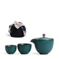 Portable teaware set featuring a teapot and two cups with a red carrying pouch for convenient tea on the go.