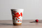 Japanese ceramic mug featuring a delicate flower pattern and elegant round shape on a wooden surface.