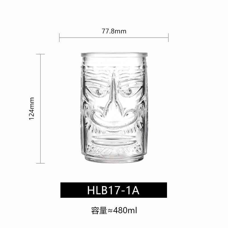 Transparent drinkware featuring unique embossed face designs in six cylindrical glass mugs.