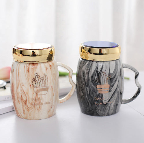 Marbling mug set with colorful designs and gold accents, perfect for stylish coffee lovers.