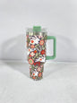 Christmas pattern mug with festive reindeer design and green handle, perfect for holiday beverages.