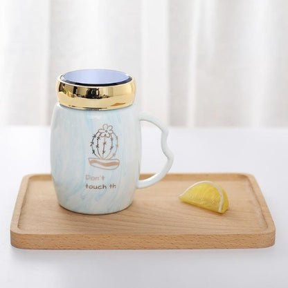 Marbling mug set with colorful designs and gold accents, perfect for stylish coffee lovers.