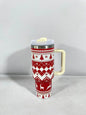 Christmas pattern mug with festive reindeer design and green handle, perfect for holiday beverages.