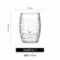 Transparent drinkware featuring unique embossed face designs in six cylindrical glass mugs.