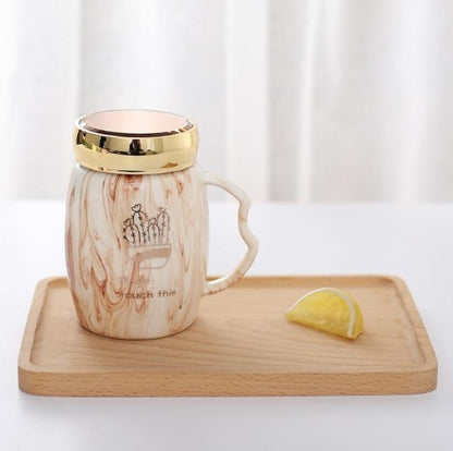 Marbling mug set with colorful designs and gold accents, perfect for stylish coffee lovers.
