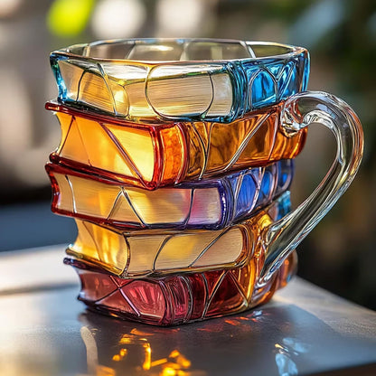 Book shaped glass mug featuring a colorful 3D design resembling a stack of illustrated books.