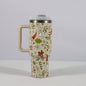 Christmas pattern mug with festive reindeer design and green handle, perfect for holiday beverages.