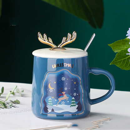 easy grip coffee mug set in festive Christmas colors with decorative antlers, perfect for holiday beverages.