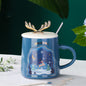 easy grip coffee mug set in festive Christmas colors with decorative antlers, perfect for holiday beverages.