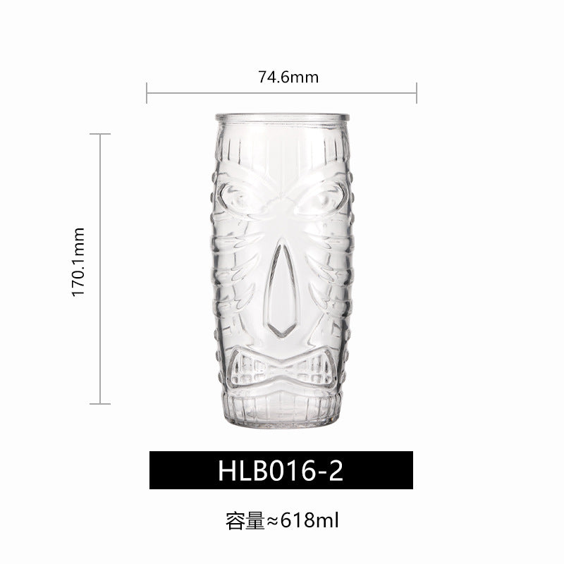 Transparent drinkware featuring unique embossed face designs in six cylindrical glass mugs.