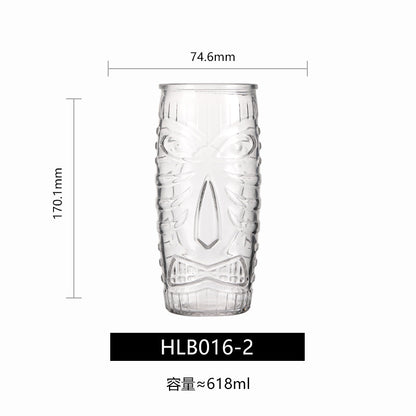 Transparent drinkware featuring unique embossed face designs in six cylindrical glass mugs.