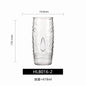 Transparent drinkware featuring unique embossed face designs in six cylindrical glass mugs.