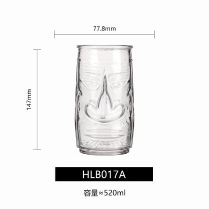 Transparent drinkware featuring unique embossed face designs in six cylindrical glass mugs.