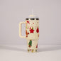 Christmas pattern mug with festive reindeer design and green handle, perfect for holiday beverages.