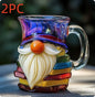 Book shaped glass mug featuring a colorful 3D design resembling a stack of illustrated books.