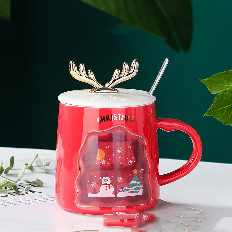 easy grip coffee mug set in festive Christmas colors with decorative antlers, perfect for holiday beverages.
