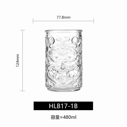 Transparent drinkware featuring unique embossed face designs in six cylindrical glass mugs.