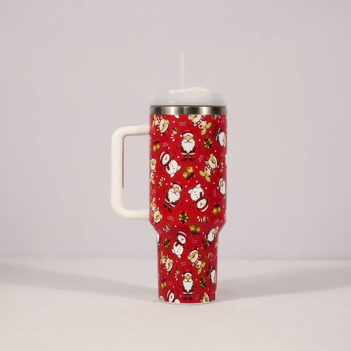 Christmas pattern mug with festive reindeer design and green handle, perfect for holiday beverages.
