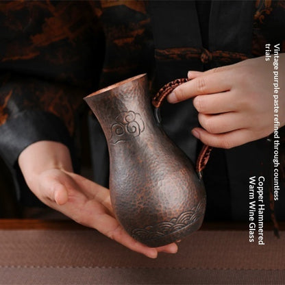 Purple liquor pot with hammered copper finish and elegant handle, ideal for serving wine and spirits.